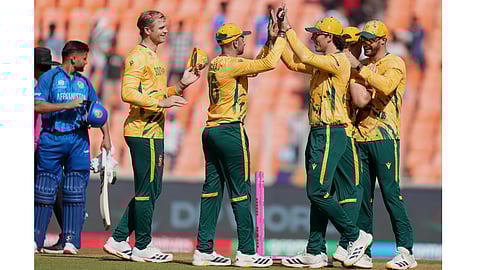 South Africa cricketers celebrate the win over Afghanistan in super over during the T20 World Cup cricket match between Afghanistan and South Africa in Ahmedabad, India, Wednesday, Feb. 11, 2026