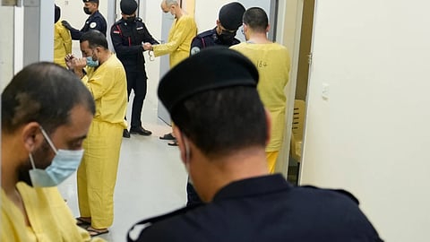 Iraqi security forces lead suspected Islamic State militants for questioning, after they were transferred from Syria to Iraq, at Al-Karkh Central Prison in Baghdad, Iraq