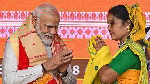 Prime Minister Narendra Modi being felicitated during a BJP workers meeting in Guwahati