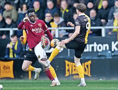 West Ham United's Kyle Walker-Peters and Burton Albion's Sebastian Revan fight for possesion in the fourth round match