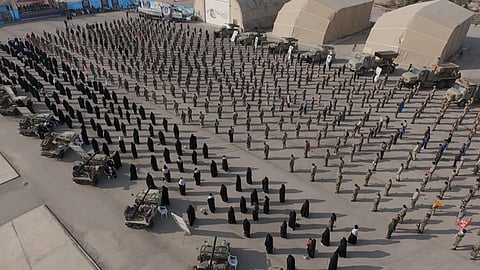 In this image provided by Sepahnews of the Iranian Revolutionary Guard on Feb. 16, 2026, shows troops standing at attention during the guard’s drill in the Persian Gulf on Monday, Feb. 16, 2026.