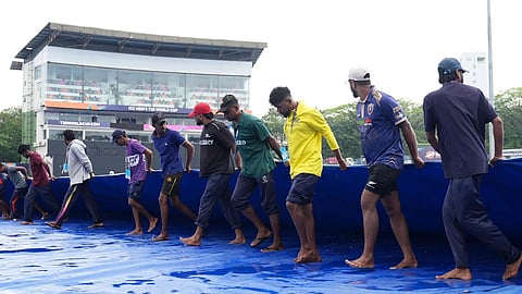 Pitch getting covered by the ground staff in Pallekele International Cricket Stadium
