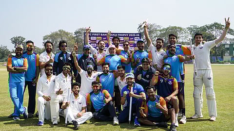 Jammu and Kashmir players with their coach and support staff pose for a group photo after their victory
