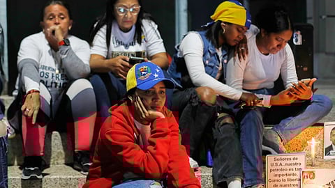 Relatives of detainees they say are held for political reasons wait outside El Helicoide, the headquarters of Venezuela's intelligence service and a detention center, after the National Assembly approved an amnesty bill in Caracas, Venezuela.
