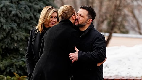 Denmark's Prime Minister Mette Frederiksen, centre, is welcomed by Ukraine's President Volodymyr Zelenskyy and his wife Olena Zelenska, left, before a service at St. Sophia Cathedral in Kyiv, Ukraine