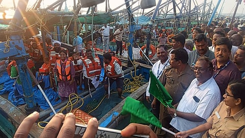 DRO Sankaranarayanan and assistant SP Meera Kodiya flag off the first boat to Katchatheevu in Rameswaram