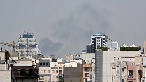 Smoke rises on the skyline after an explosion in Tehran, Iran