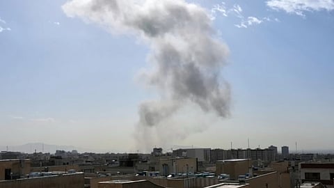 Smoke rises on the skyline after an explosion in Tehran, Iran