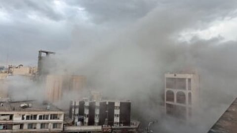 Smoke engulfs a street after a strike in Tehran, Iran, Monday, March 2, 2026.