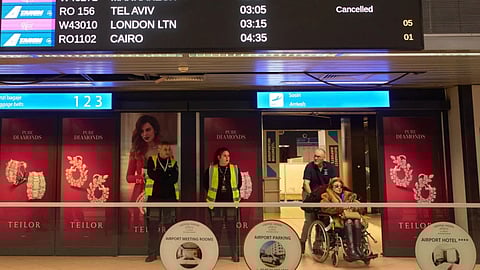 A display in the arrivals terminal of the Henri Coanda International Airport shows cancelled flights originating in Middle East countries, in Otopeni, Romania.