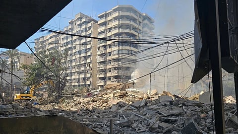 Smoke rises above debris at the site of a building hit in an Israeli airstrike on Dahiyeh, a southern suburb of Beirut, Lebanon