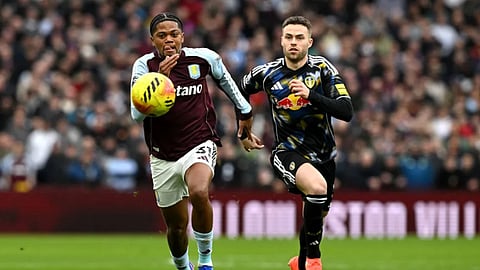 Aston Villa’s Leon Bailey, left, and Leeds United’s Gabriel Gudmundsson battle for the ball during their English Premier League soccer match in Birmingham, England, Saturday, Feb. 21, 2026.