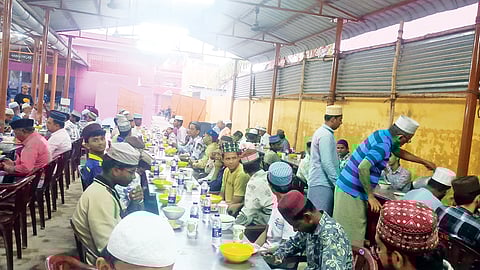 The faithful break fast outside a mosque in Kayalpatnam