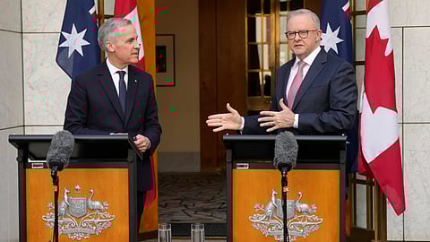 Canada's Prime Minister Mark Carney, left, and Australian Prime Minister Anthony Albanese participate in a joint news conference, in Canberra, Australia