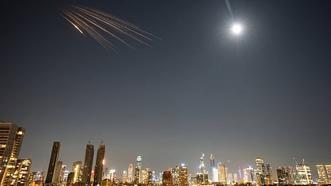 Missiles launched from Iran are seen in the sky over central Israel