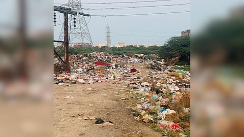 Waste getting dumped in Perumbakkam marshy lands.