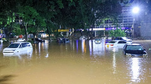 Cars are seen submerged after heavy rains flooded roads in Nairobi, Kenya