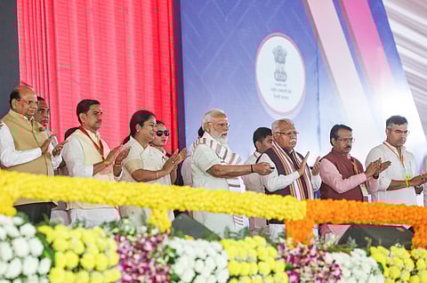 Prime Minister Narendra Modi with Union Minister of Housing and Urban Affairs Manohar Lal and Delhi CM Rekha Gupta during the inauguration and foundation stone laying ceremony of multiple development works, New Delhi