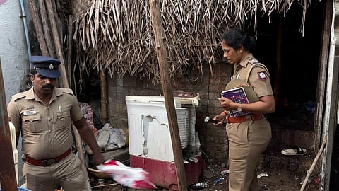 Police collecting evidence at the murder site