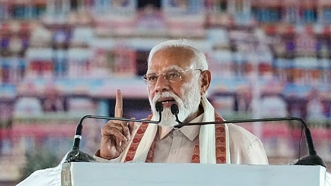 Prime Minister Narendra Modi addresses a gathering during an NDA election campaign meeting for the state Assembly polls, in Tiruchirapalli, Tamil Nadu