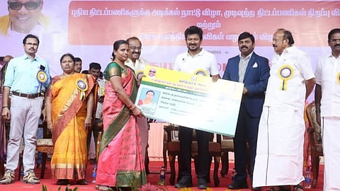 Deputy CM Udhayanidhi gives away welfare aid to a woman beneficiary in Dharmapuri on Friday