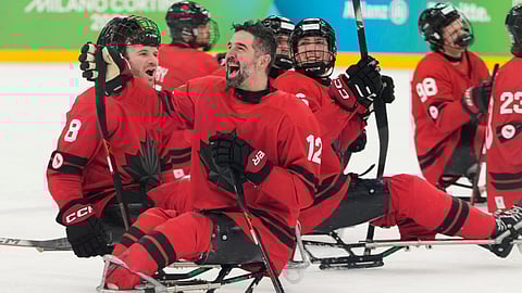 Canada players celebrate after winning a semifinal hockey match between against China at the 2026 Winter Paralympics, in Milan, Italy