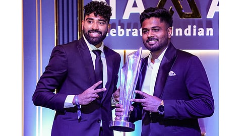 Indian men's cricket team player Sanju Samson and Mohammed Siraj with a trophy during the BCCI Naman Awards 2026, in New Delhi, Sunday, March 15, 2026