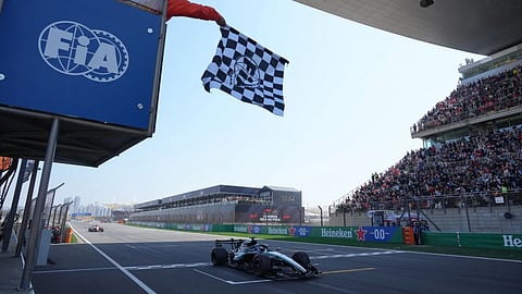 Mercedes driver George Russell of Britain crosses the finish line and wins the Sprint Race of the Chinese Formula One Grand Prix at the Shanghai International Circuit, in Shanghai, China.