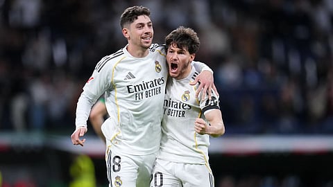 Real Madrid's Federico Valverde, left, celebrates after scoring his side's second goal during a Spanish La Liga soccer match between Real Madrid and Elche CF, in Madrid