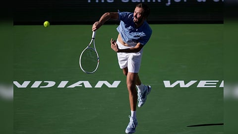 Daniil Medvedev, of Russia, serves against Carlos Alcaraz, of Spain, during a semifinal match at the BNP Paribas Open tennis tournament,
in Indian Wells, Calif.