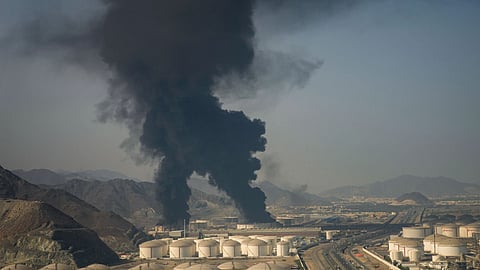 Fire and plumes of smoke rise from an oil facility in Fujairah, United Arab Emirates, Saturday, March 14, 2026.