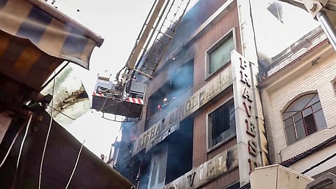 Rescue operations underway after a fire broke out in a residential building near Palam Metro station, in New Delhi, Wednesday, March 18, 2026