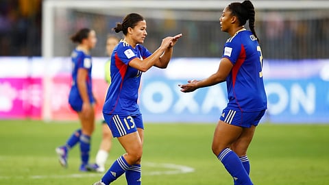 Philippines' Angela Beard, left, and teammate Jessika Cowart reached following during the Women's Asia Cup soccer match between Australia and the Philippines in Perth, Australia