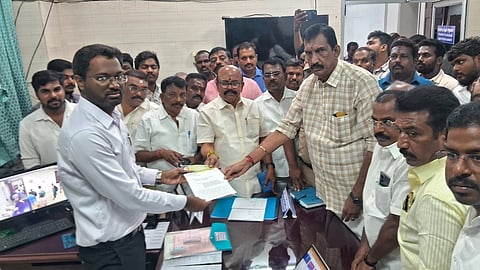 AIADMK functionaries led by Pollachi V Jayaraman submitted a formal complaint to the election officials in Pollachi on Thursday