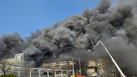 Black smoke rises from an auto parts plant in Daejeon, South Korea