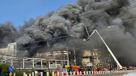 Black smoke rises from an auto parts plant in Daejeon, South Korea