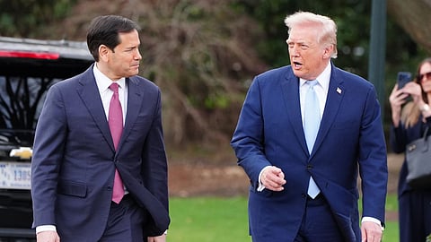 President Donald Trump walks with Secretary of State Marco Rubio before departing on Marine One from the South Lawn of the White House, Friday, March 20, 2026, in Washington.