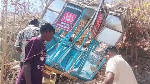 People inspect a damaged ropeway trolley after an alleged crash near Khallari Mata Temple, in Mahasamund district of Chhattisgarh, Sunday, March 22, 2026.