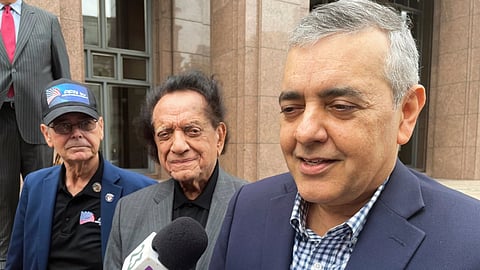 Former U.S. Rep. David Rivera speaks with media outside a federal court in Miami