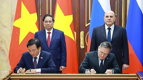 Vietnamese Prime Minister Pham Minh Chinh, standing left and Russian Prime Minister Mikhail Mishustin, standing right, witness a signing ceremony of agreements during Chinh's official visit in Moscow, Russia.
