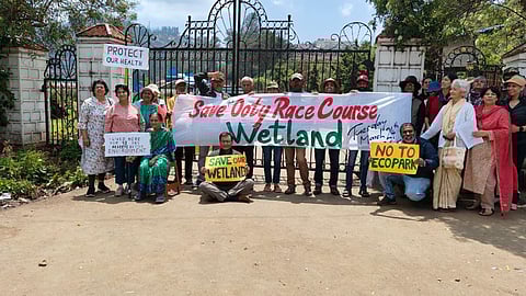 Environmental activists protested at the entrance of the Race Course in Ooty on Tuesday