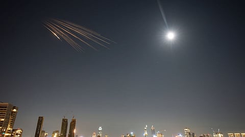 Missiles launched from Iran are seen in the sky over central Israel, Thursday, March 5, 2026