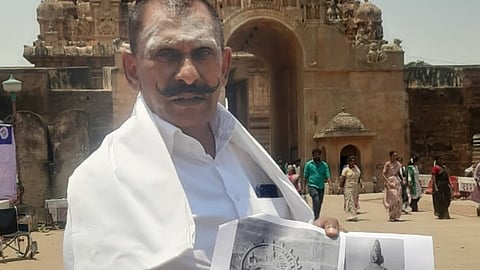 Former IGP Ponn Manickavel shows the images of missing idols in Thanjavur on Friday