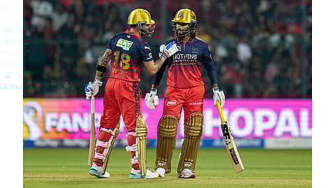 Royal Challengers Bengaluru's Rajat Patidar, right, and Virat Kohli during an Indian Premier League (IPL) 2026 T20 cricket match between Royal Challengers Bengaluru and Sunrisers Hyderabad, at the M Chinnaswamy Stadium, in Bengaluru, Karnataka