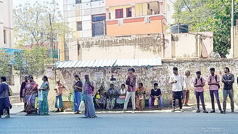 The makeshift bus shelter offers little cover for passengers