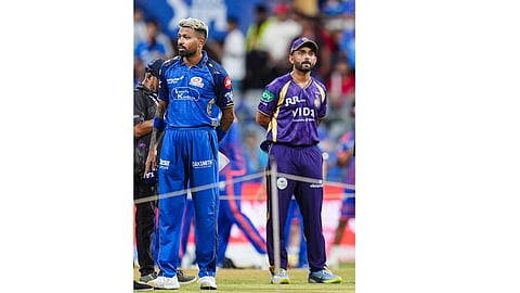 Mumbai Indians' captain Hardik Pandya, left, and Kolkata Knight Riders' captain Ajinkya Rahane during the toss before an Indian Premier League (IPL) 2026 T20 cricket match between Mumbai Indians and Kolkata Knight Riders, at the Wankhede Stadium, in Mumbai, Maharashtra, Sunday, March 29, 2026