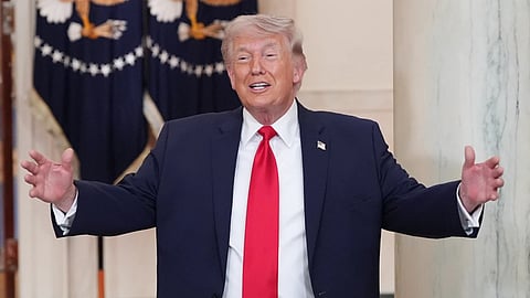 President Donald Trump gestures after speaking about the Iran war from the Cross Hall of the White House