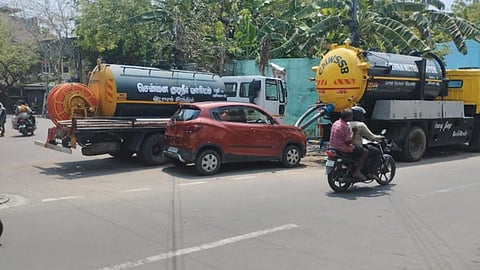 Cars and lorries are seen parked at trisection where Madha Church Road, TM Soundararajan Road and Trust Main Road meet