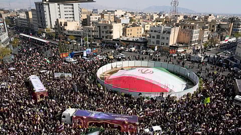 Mourners gather during a funeral procession for Alireza Tangsiri, head of Iran's Islamic Revolutionary Guard Corps Navy, and others killed in Israeli strikes in late March, in Tehran, Iran