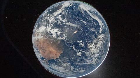 A view of Earth taken by NASA astronaut and Artemis II Commander Reid Wiseman from of the Orion spacecraft's window after completing the translunar injection burn